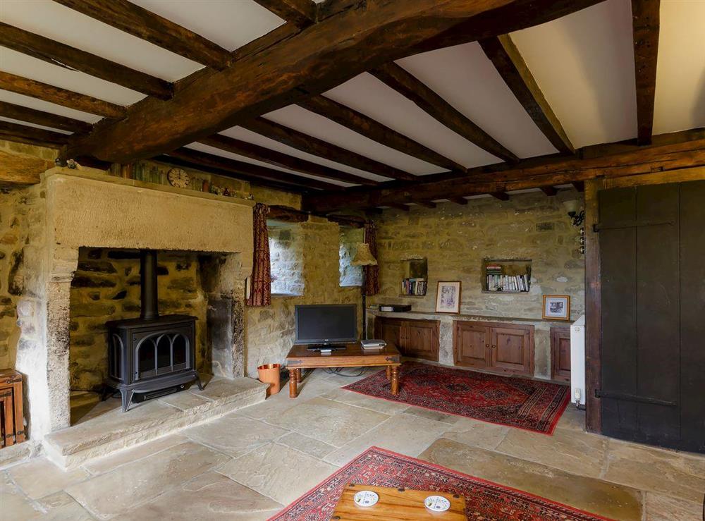 Characterful living room with beamed ceiling (photo 2) at Highbury Cottage in Hathersage, South Yorkshire