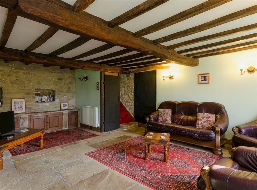 Characterful living room with beamed ceiling (photo 3) at Highbury Cottage in Hathersage, South Yorkshire
