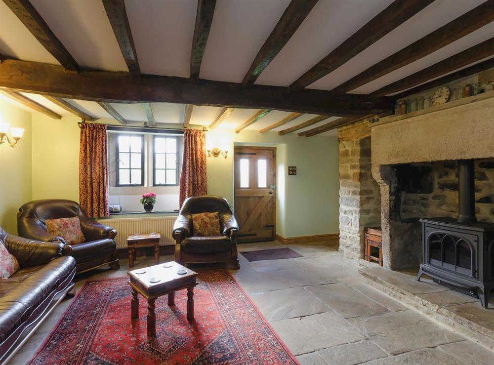 Characterful living room with beamed ceiling at Highbury Cottage in Hathersage, South Yorkshire