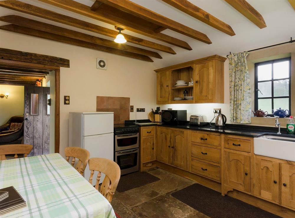 Country-style kitchen and dining area at Highbury Cottage in Hathersage, South Yorkshire