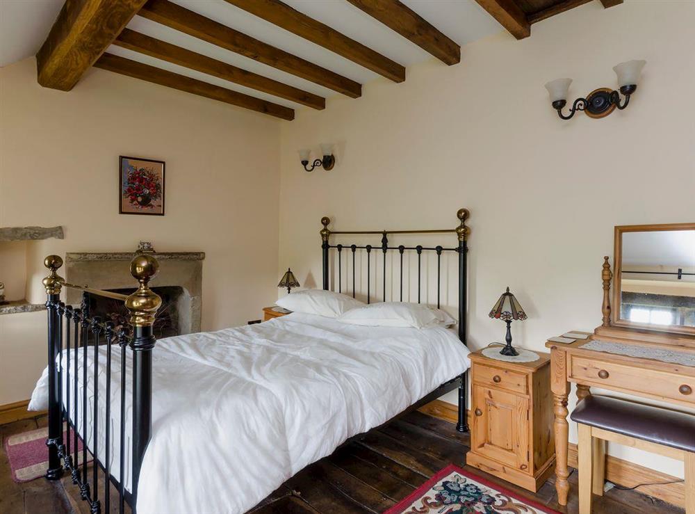 Traditional double bed room beamed ceiling and wooden floors (photo 2) at Highbury Cottage in Hathersage, South Yorkshire