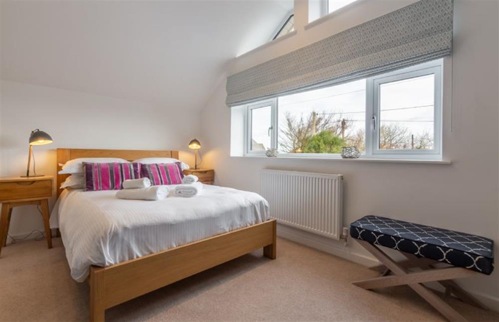 Bedroom three, a small king-size room with an en-suite shower room at Highcroft, St Minver