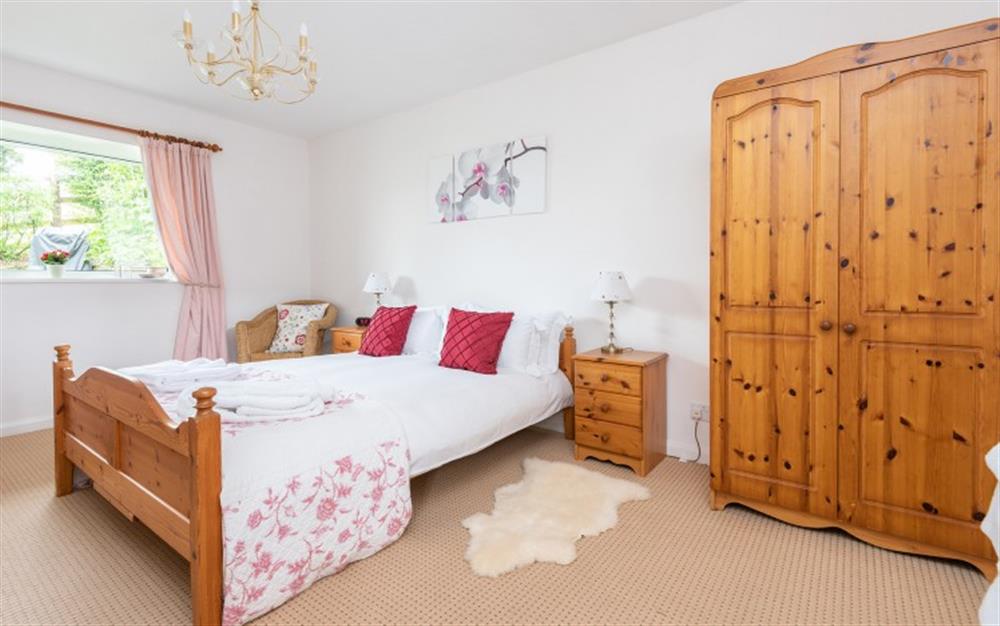 The comfortable bedroom at Higher Beneknowle Cottage in Diptford