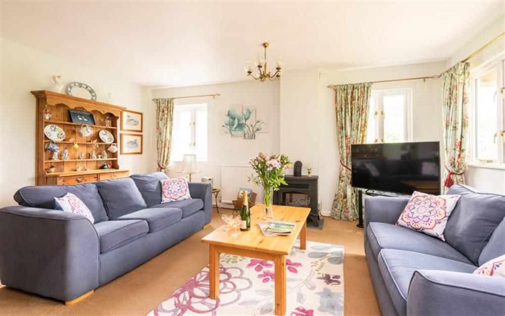 The cosy and light living room at Higher Beneknowle Cottage in Diptford