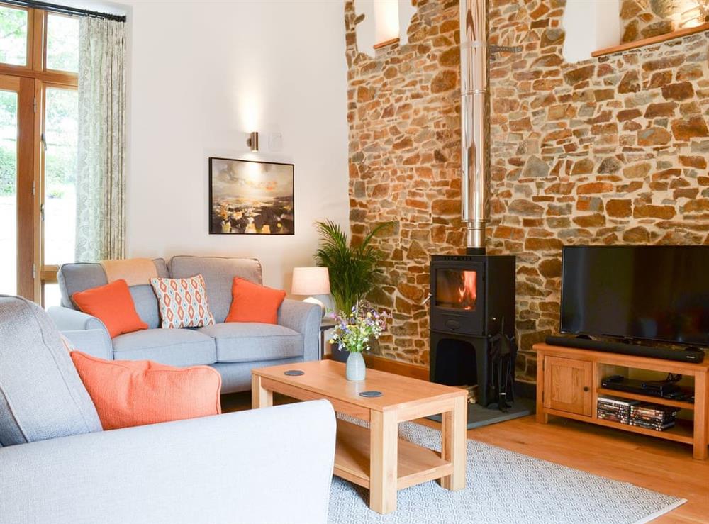 Welcoming living area with wood burner at Horse Gin, 