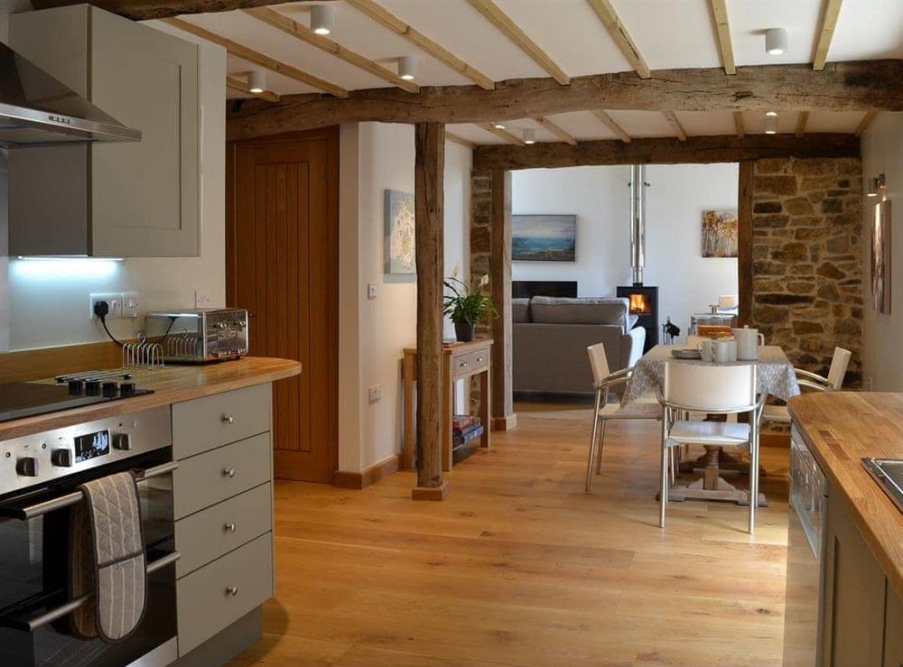Fully equipped kitchen with open aspect through to the living room at The Oak Stall, 