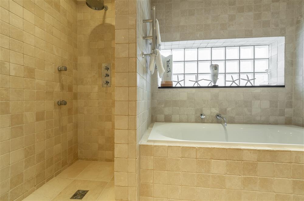En-suite bathroom with large bath and walk-in shower (photo 2) at Higher Close, Mawgan Porth