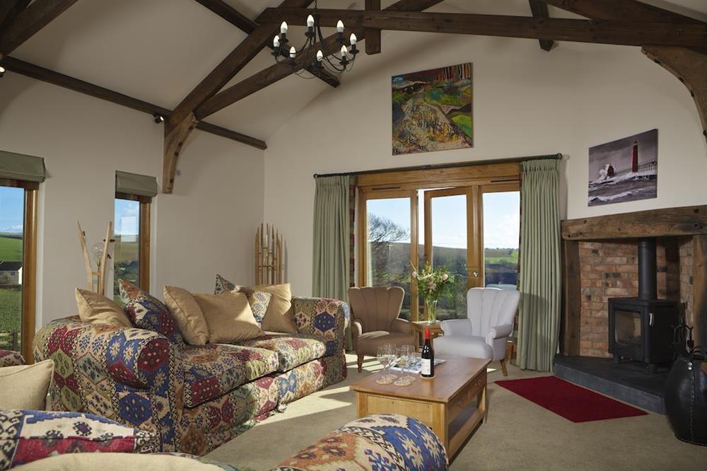 Lounge with original, vaulted cross beamed ceiling at Higher Hill Barn in , Nr Kingsbridge