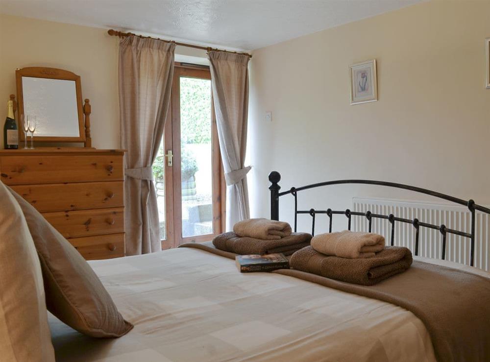 Comfortable double bedroom at Higher Hopworthy Cottage, 