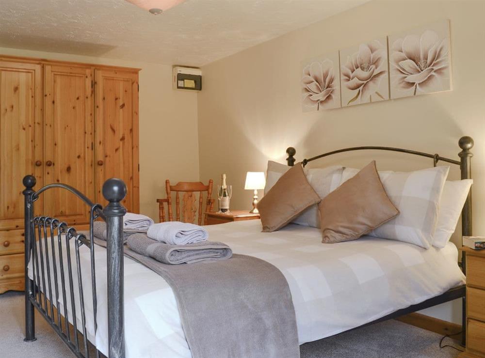 Spacious double bedroom at Higher Hopworthy Cottage, 