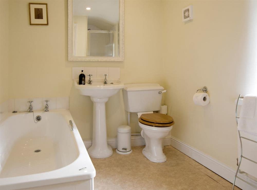 Family bathroom with bath and separate shower cubicle at Higher Scarcliffe in Broughton, near Skipton, North Yorkshire