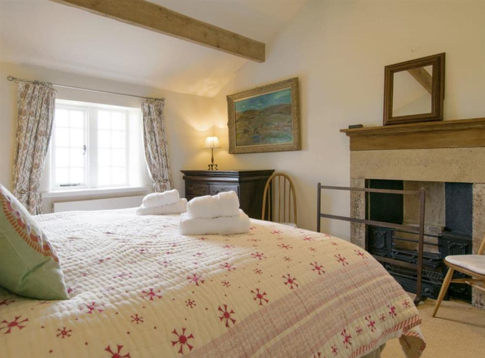 Second double bedroom with feature fireplace at Higher Scarcliffe in Broughton, near Skipton, North Yorkshire