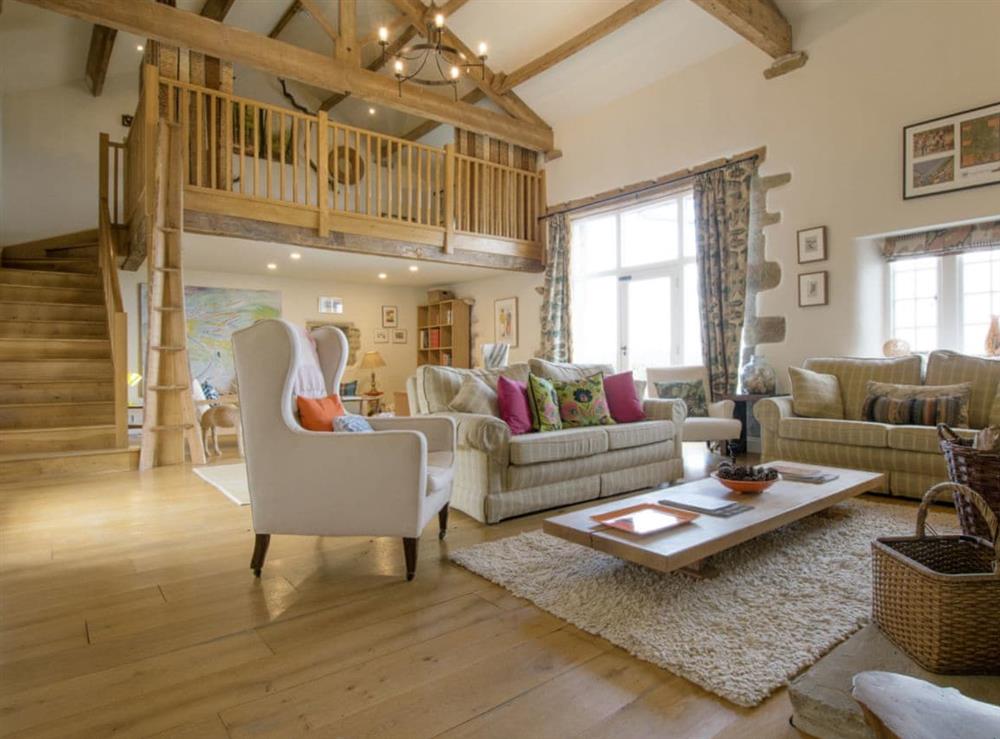 Stunning living room with high vaulted ceiling and mezzanine at Higher Scarcliffe in Broughton, near Skipton, North Yorkshire