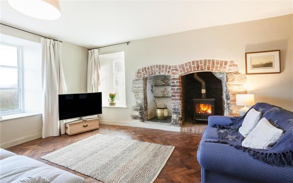 The more formal lounge, light and airy again with lovely character features and log burner. at Higher Sutton in Thurlestone