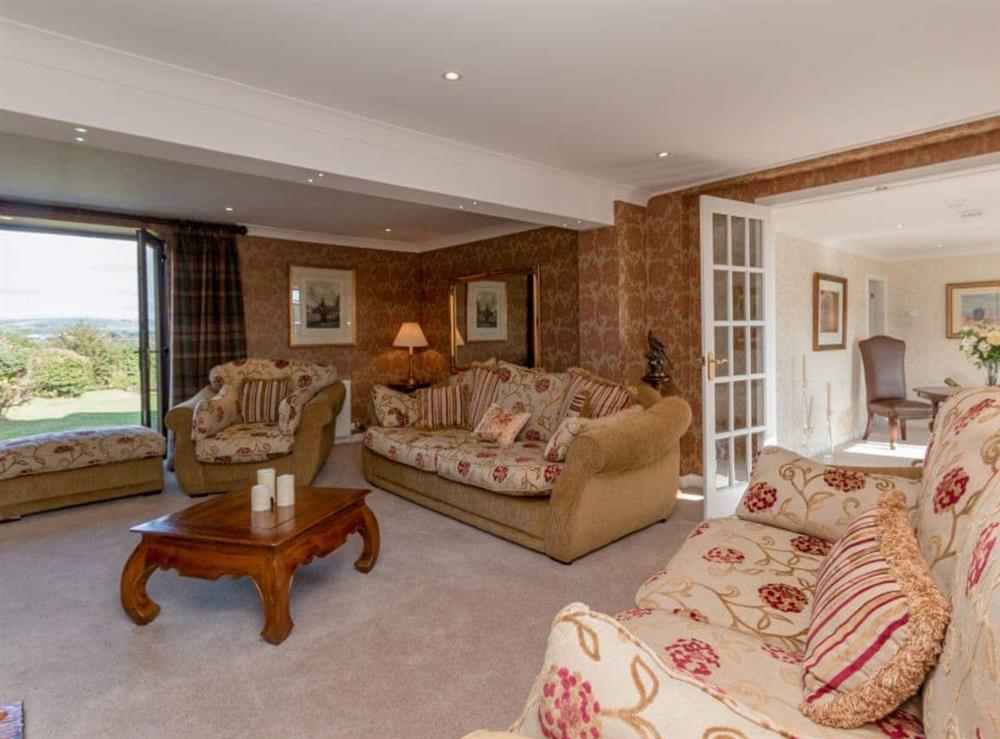 Living room with French doors leading to the garden (photo 2) at Hill End Farmhouse in Dalry, Ayrshire