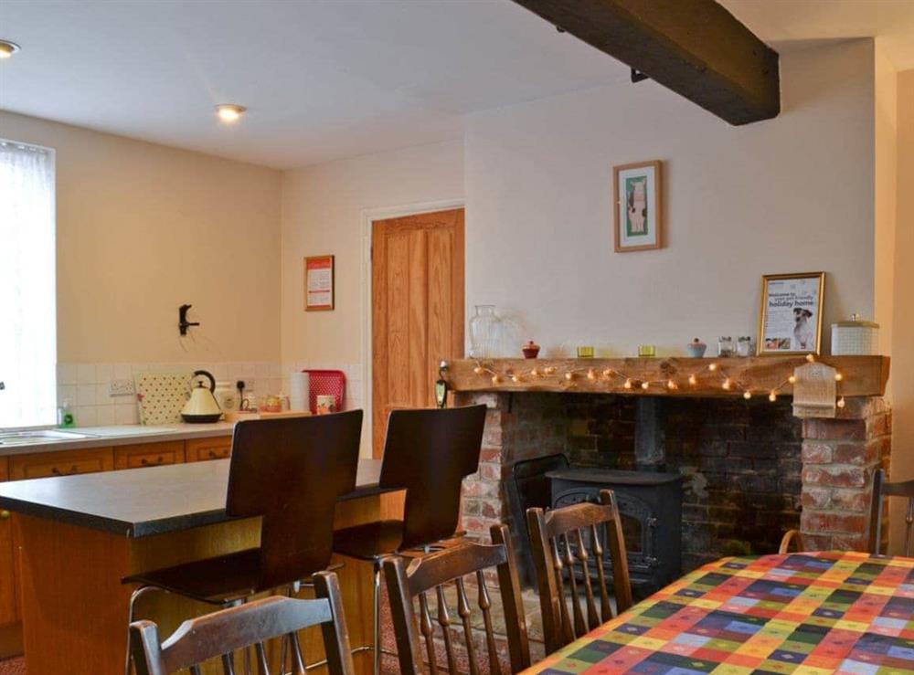 Family kitchen/dining room with wood burning stove at Hill Farm in Harby, near Melton Mowbray, Leicestershire