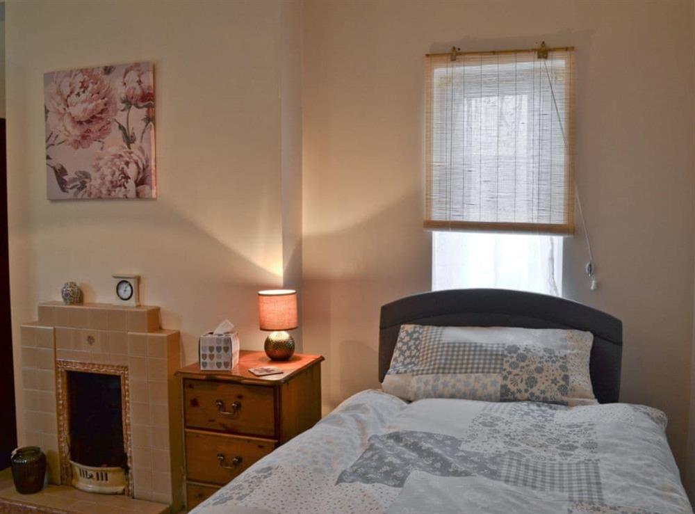 Single bedroom with period fireplace at Hill Farm in Harby, near Melton Mowbray, Leicestershire