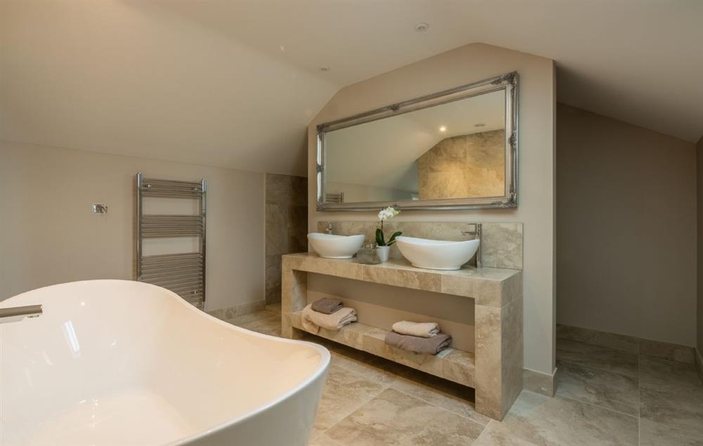 Master en-suite bathroom with slipper bath and walk-in shower at Hill Farm Massingham, Little Massingham