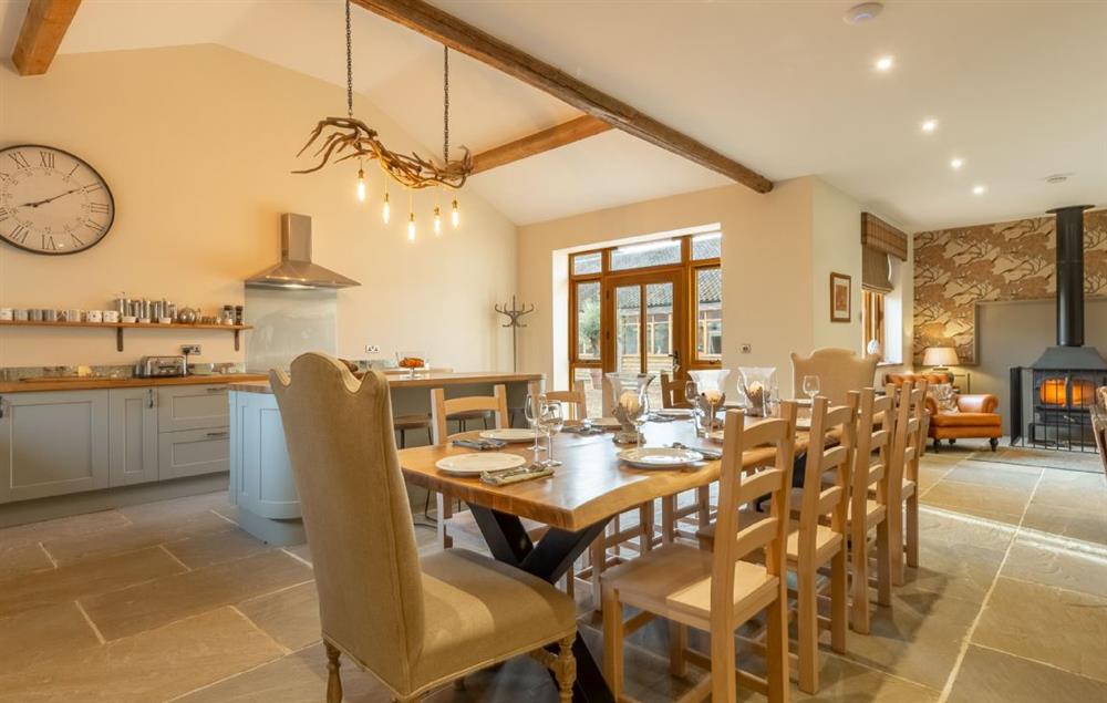 Open plan dining area with hand made table seating fourteen guests at Hill Farm Massingham, Little Massingham