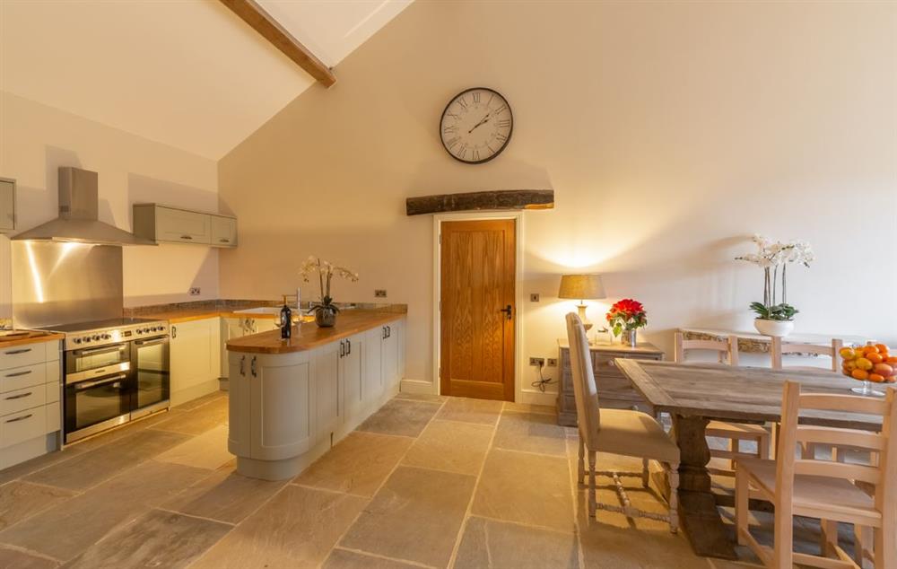 Open plan fully equipped kitchen, snug and dining area seating six guests at Hill Farm Massingham, Little Massingham