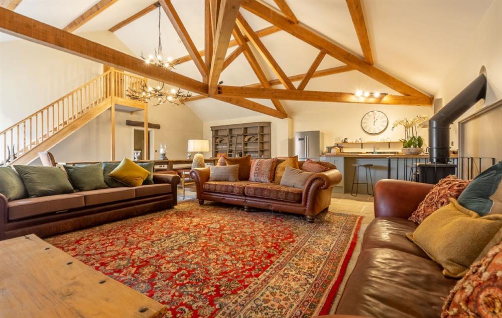 Spacious open plan sitting room with wood burning stove at Hill Farm Massingham, Little Massingham