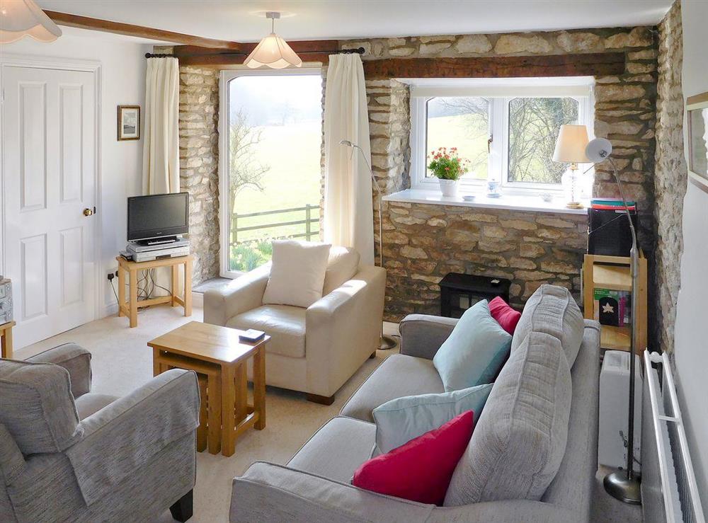 Beamed living/dining room with views to the surrounding countryside at Hill Mill Cottage in Nr Wotton-under-Edge, Glos., Gloucestershire