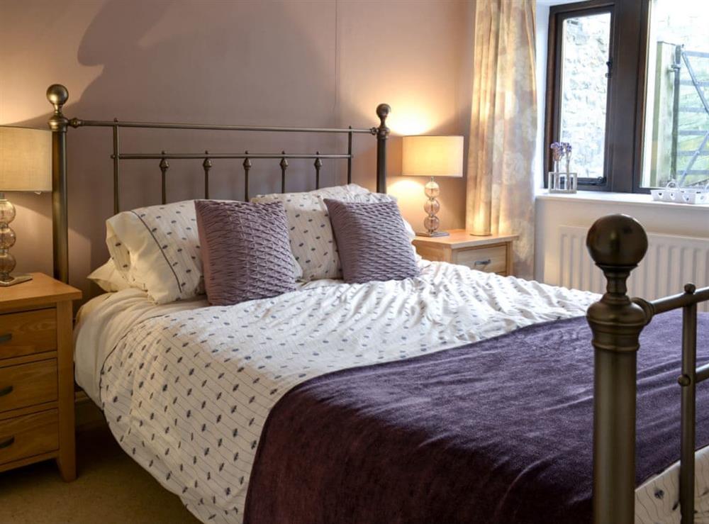 Relaxing bedroom with kingsize bed at Hill Top Barn in Starbotton, near Skipton, North Yorkshire