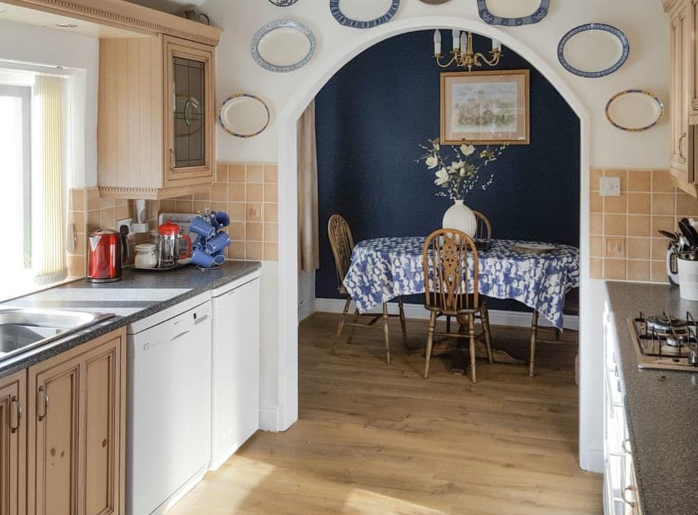 Well-equipped kitchen with convenient dining area at Hill View Cottage in Sleights, near Whitby, North Yorkshire