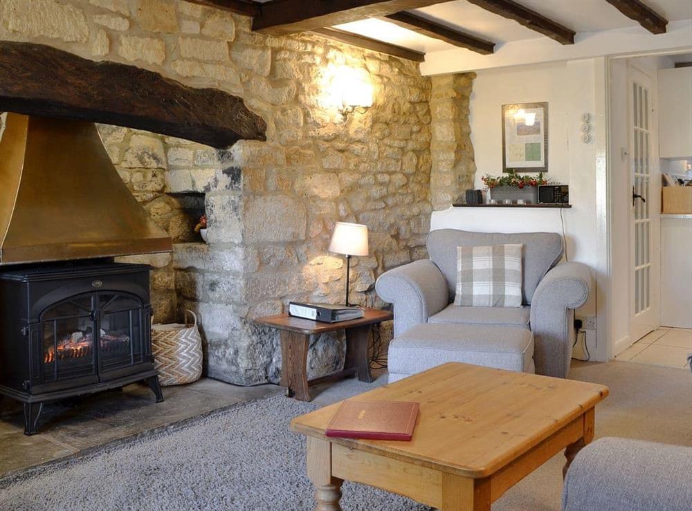 Charming lounge with heritage wood beams at Hill View Cottage in Snowshill, Worcestershire