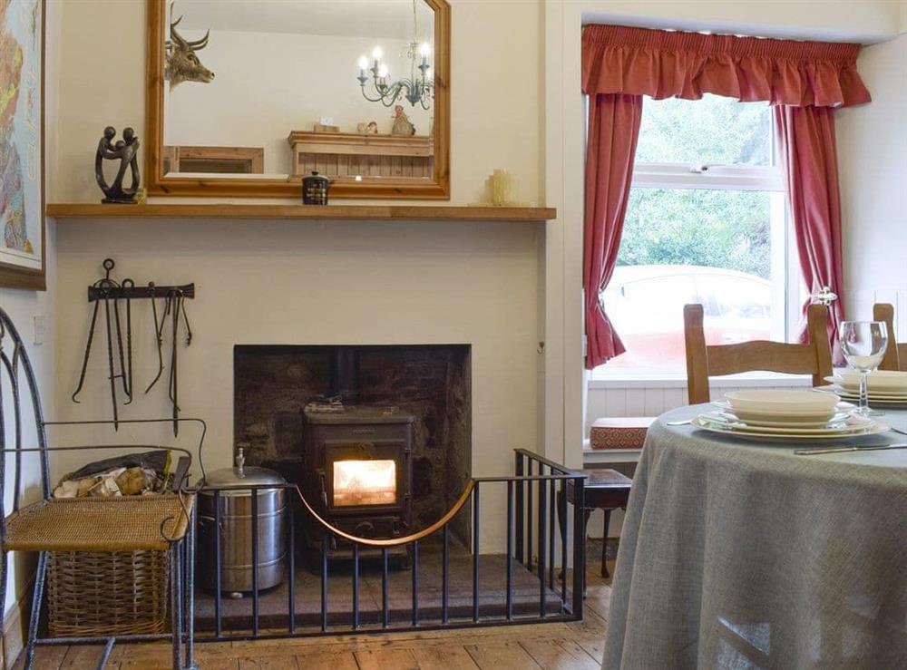 Warming wood burner within dining area at Hill View House in Aberfeldy, Perthshire