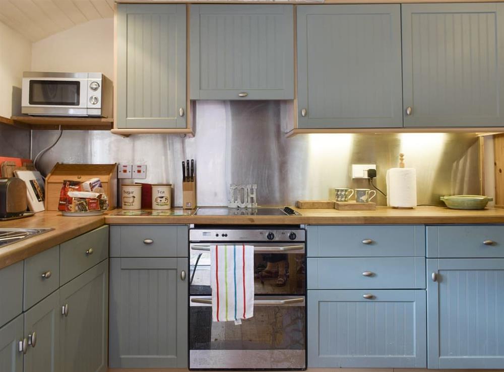 Well-equipped kitchen with dining space at Hill View House in Aberfeldy, Perthshire