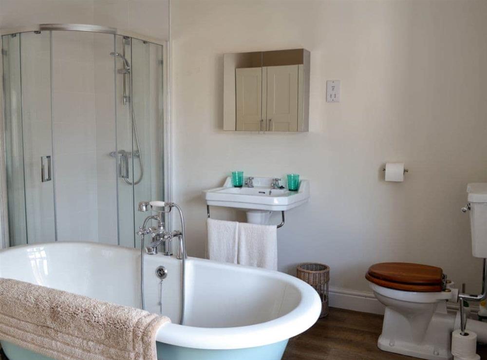 Bathroom with roll-top bath & shower at Hillgarth in Askrigg, near Hawes, North Yorkshire