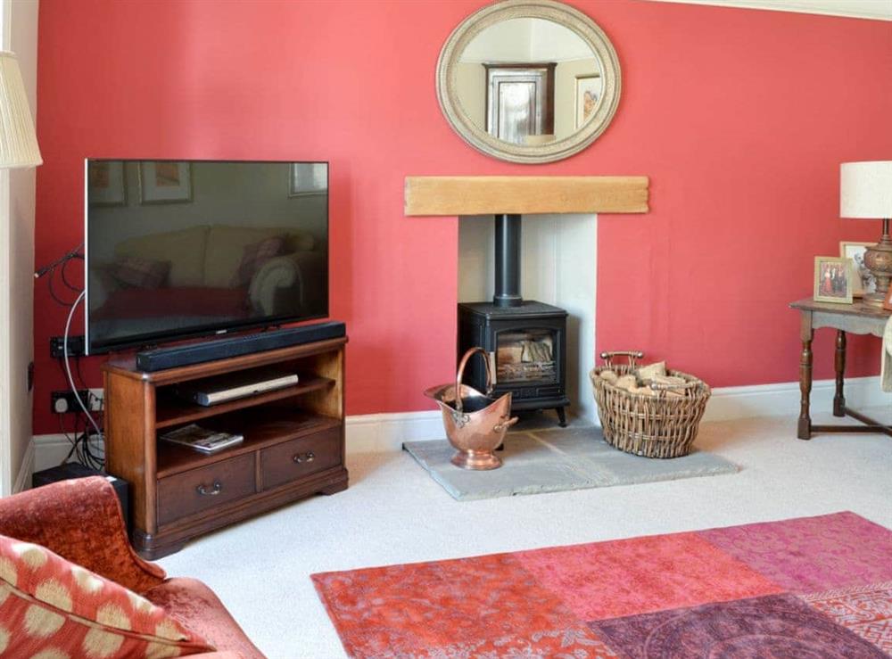 Living room with wood burner at Hillgarth in Askrigg, near Hawes, North Yorkshire