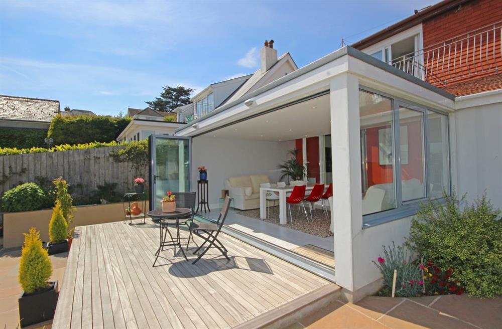 Bi-folding doors from conservatory open onto sunny decking (photo 2) at Hillsbrook in , Salcombe