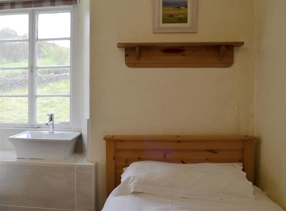 Comfy twin bedroom at Hillside Cottage in Ambleside, Cumbria