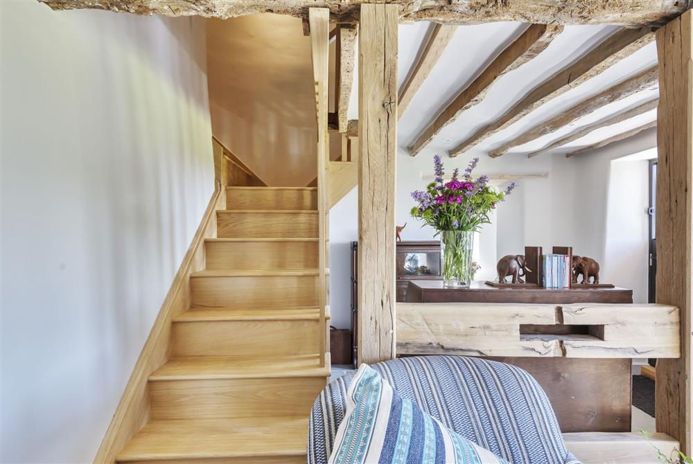 Beautiful wooden open stairs leading to the first floor at Hilltop Cottage, Wimborne