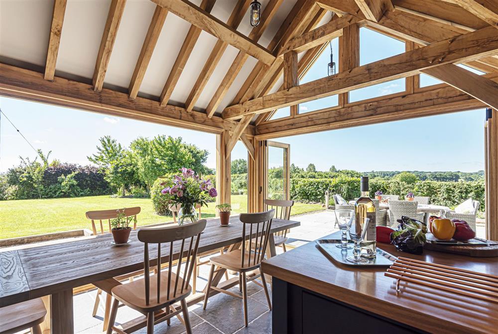 The bi-folding doors allow the kitchen and dining area to fully connect to the wonderful garden at Hilltop Cottage, Wimborne