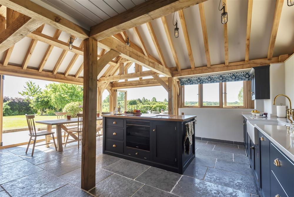 The spacious kitchen with central island at Hilltop Cottage, Wimborne