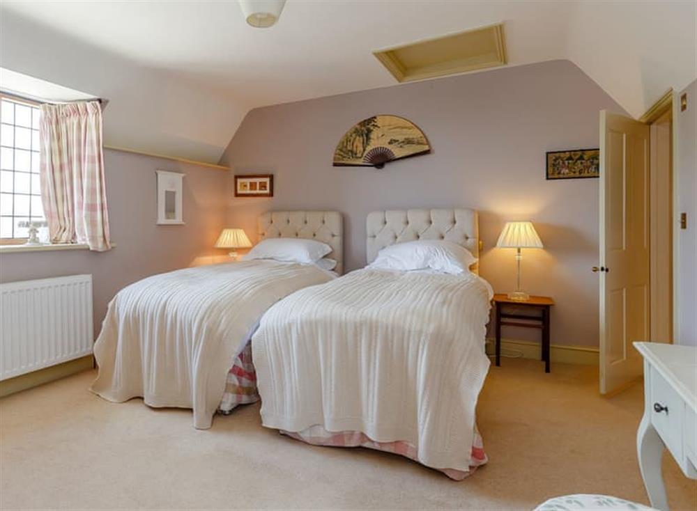 Charming twin bedroom at Hinton Manor in Hinton Manor, England