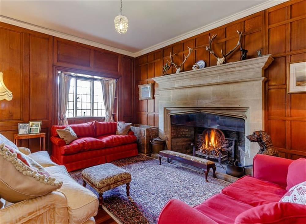 Spectacular drawing room with open fire at Hinton Manor in Hinton Manor, England