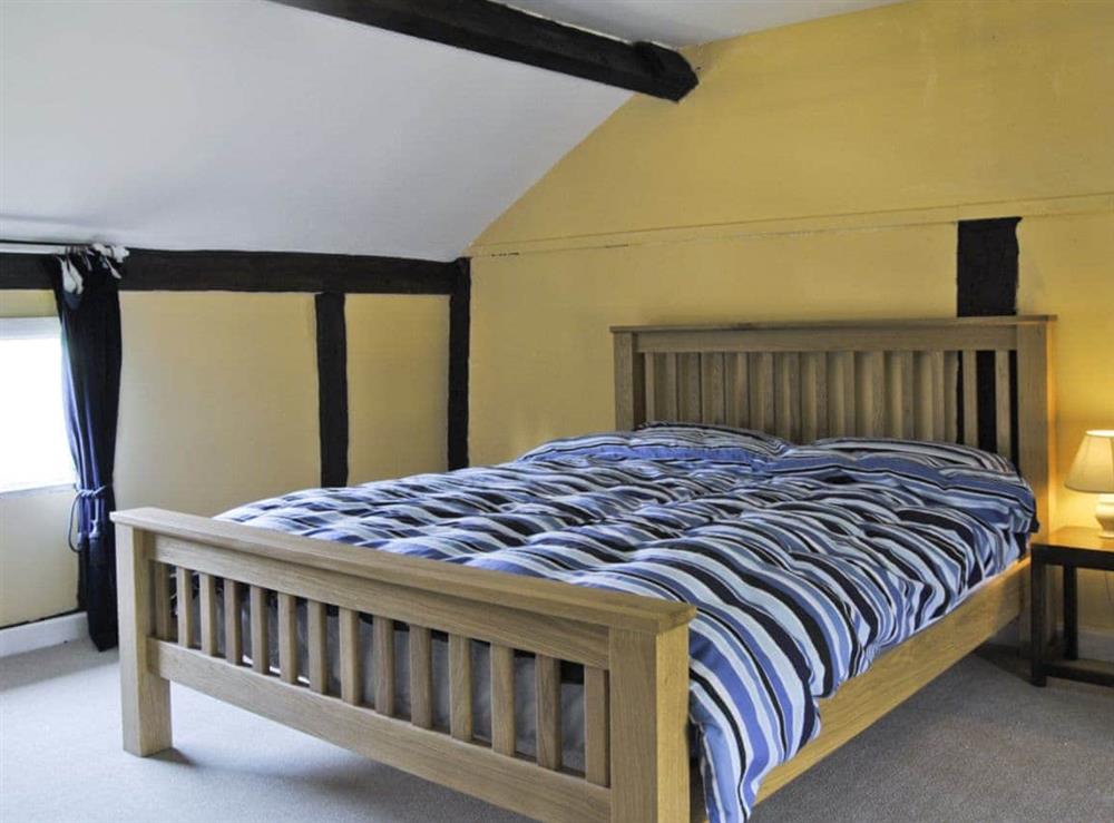 Double bedroom (photo 2) at Hirros Hall Longhouse in Llanerfyl, near Welshpool, Powys