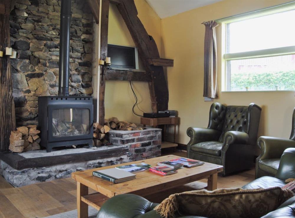 Living room at Hirros Hall Longhouse in Llanerfyl, near Welshpool, Powys