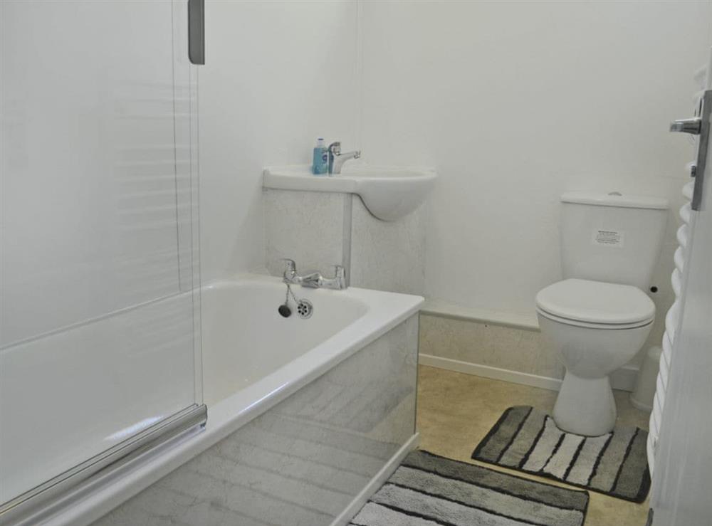 Bathroom with shower over bath at Hives in Bradworthy, near Holsworthy, Devon