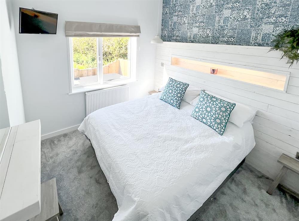 Master bedroom with king size bed at Hoburne in Bodmin, Cornwall