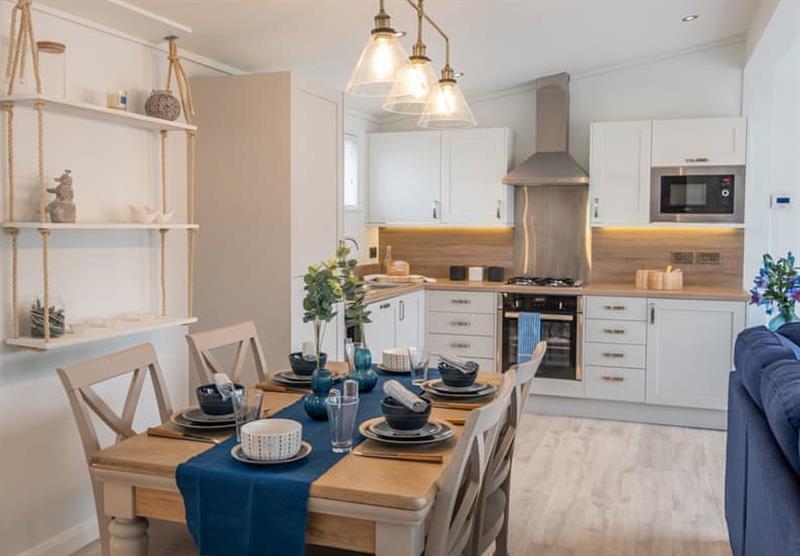 Kitchen and dining area in the Hideaway Coastal at Hoburne St Mabyn in St Mabyn, South West