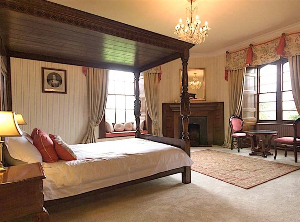 Inviting four poster bedroom at Hockwold Hall in Hockwold, near Thetford, Norfolk