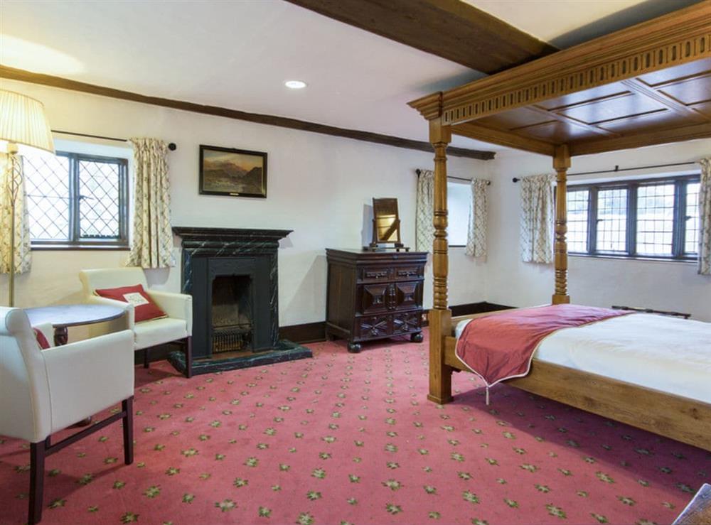 Spacious four poster bedroom at Hockwold Hall in Hockwold, near Thetford, Norfolk