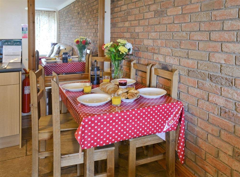 Dining area at Hoggard Cottage in Muston, Filey, North Yorkshire