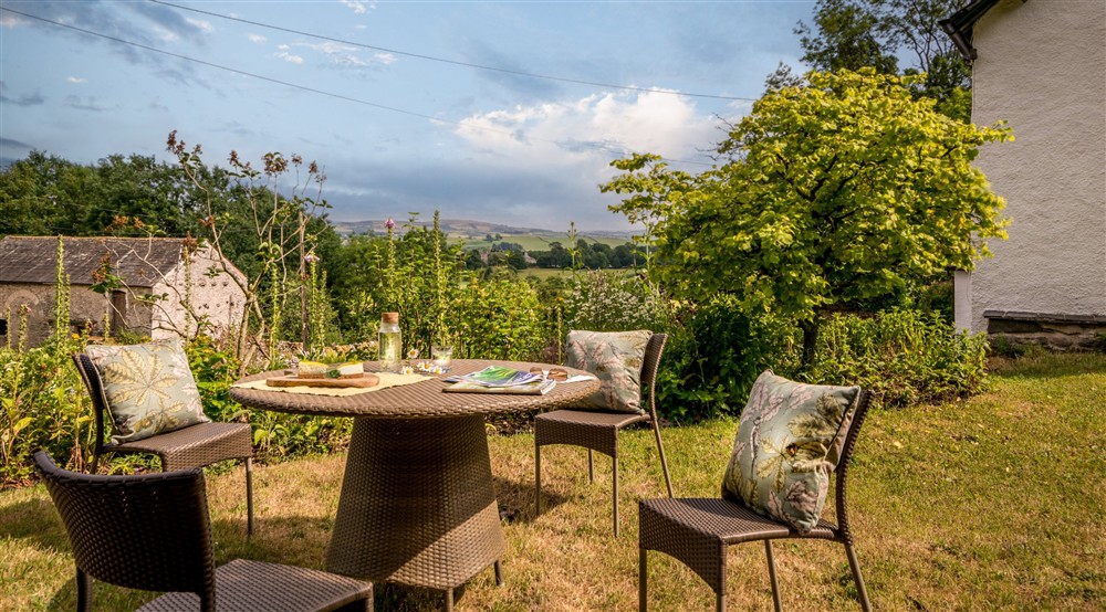 The outdoor seating at Holeslack Cottage in Kendal, Cumbria