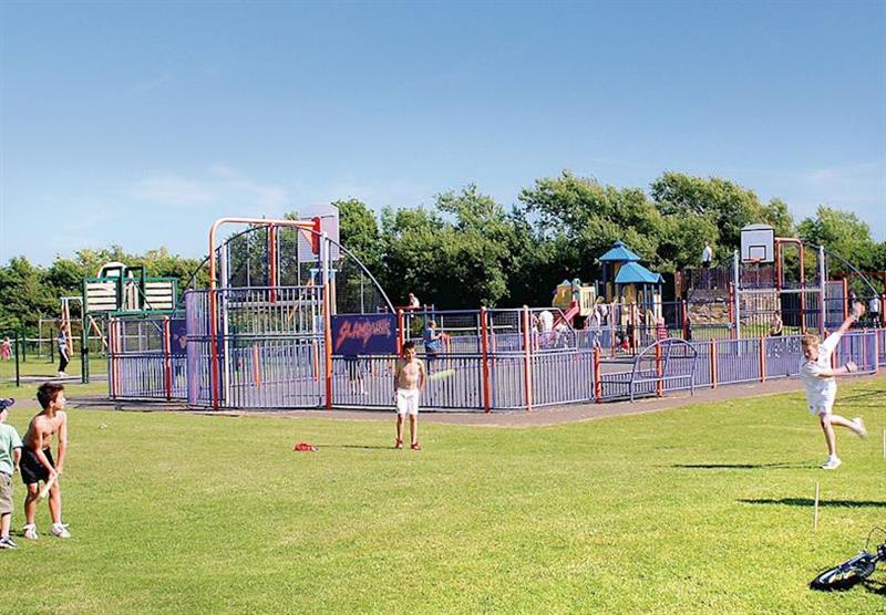 All weather sports pitch and play area at Holiday Resort Unity in Brean Sands, Somerset